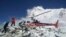 A helicopter prepares to rescue people at Everest Base Camp, which had been struck Saturday by an avalanche triggered by a massive earthquake in Nepal, on April, 27, 2015. 