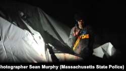 A sniper trains his bead on Tsarnaev.