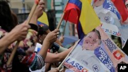 Opposition presidential candidate Guillermo Lasso's supporters protest outside Ecuador's National Electoral Council to demand the official results of the presidential elections, in Quito, Ecuador, Feb. 20, 2017.