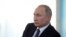 FILE - Russian President Vladimir Putin attends a meeting with members of the public in Sevastopol, Crimea, March 18, 2020. 