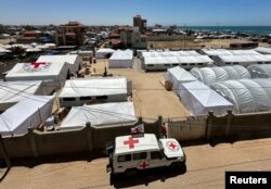 A vehicle is parked near the International Red Cross field hospital in southern Gaza on May 16, 2024. The hospital has been set up to try to meet what it described as an "overwhelming" demand for health services since Israel's military operation on Rafah began last week‏.