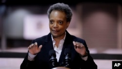 FILE - Chicago Mayor Lori Lightfoot speaks during a news conference in Hall A at the COVID-19 alternate site at McCormick Place in Chicago, April 10, 2020. 