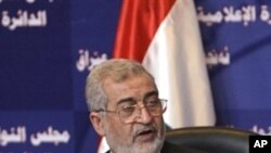 Iraqi Parliament speaker Iyad al-Samaraie gestures as he speaks during a Parliament session dealing with the electoral law, 19 Nov 2009, in Baghdad