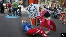 Occupy Wall Street activists perform in Zuccotti Park on the fifth anniversary of the movement in New York, Sept. 17, 2016. 