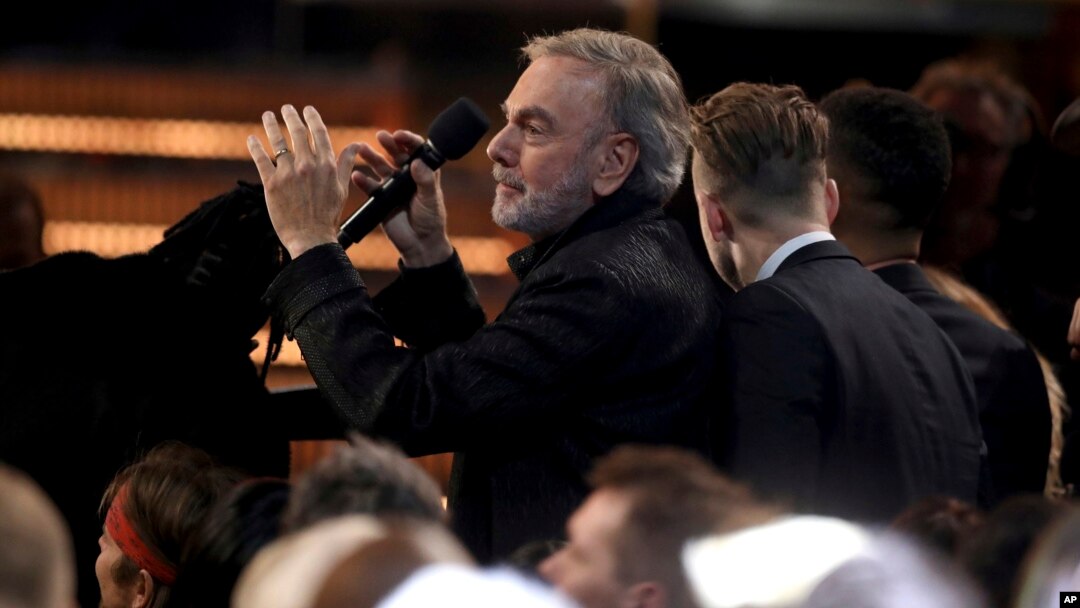 Neil Diamond leads a carpool karaoke performance of "Sweet Caroline" at the 59th annual Grammy Awards, Feb. 12, 2017, in Los Angeles.