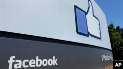 A sign at Facebook headquarters in Menlo Park, California, July 2013.