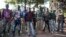 FILE - Anti-balaka fighters stand for a photo in Boda, Central African Republic, Aug. 2014.