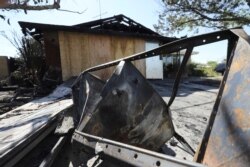 The ruins of a house that burned after a powerful earthquake struck Southern California are seen in the city of Ridgecrest, July 5, 2019.