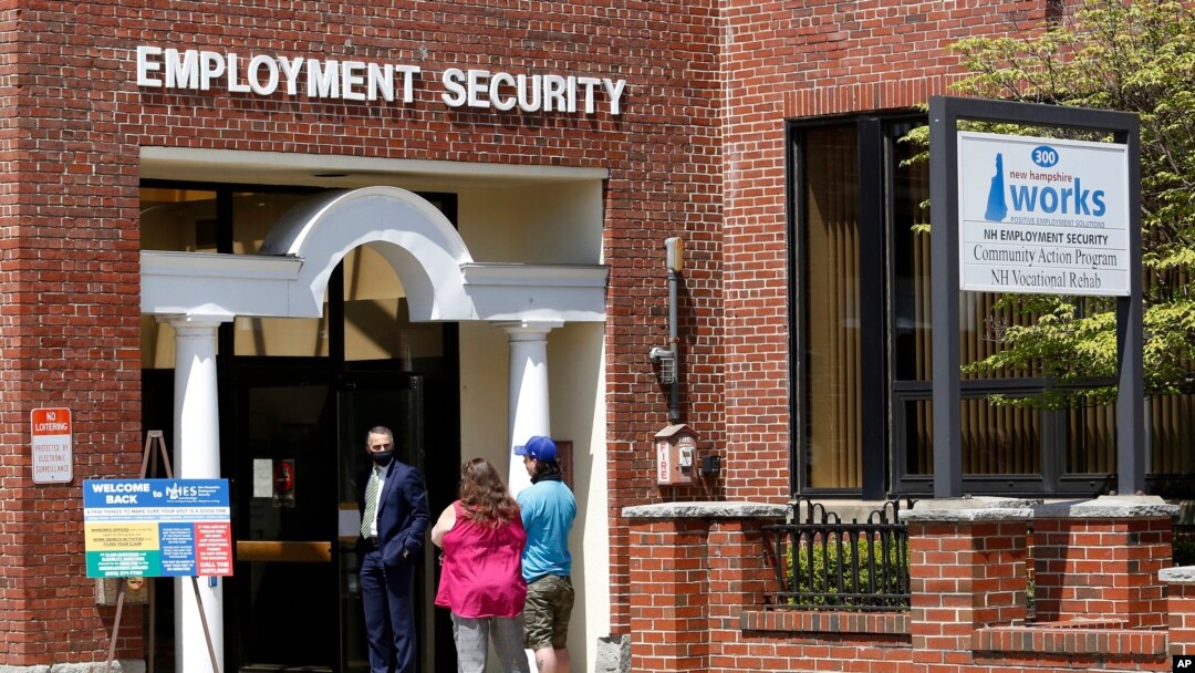FILE - Job seekers line up outside the New Hampshire Works employment security job center, in Manchester, New Hampshire, May 10, 2021. 