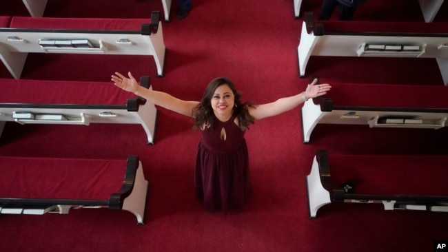 Vicky Chavez poses for a photograph at the First Unitarian Church Thursday, April 15, 2021, in Salt Lake City. Chavez, a Honduran woman in the U.S. illegally who received sanctuary in a Salt Lake City church with her two young daughters for more than three years is now free to leave without risk of deportation. (AP Photo/Rick Bowmer).