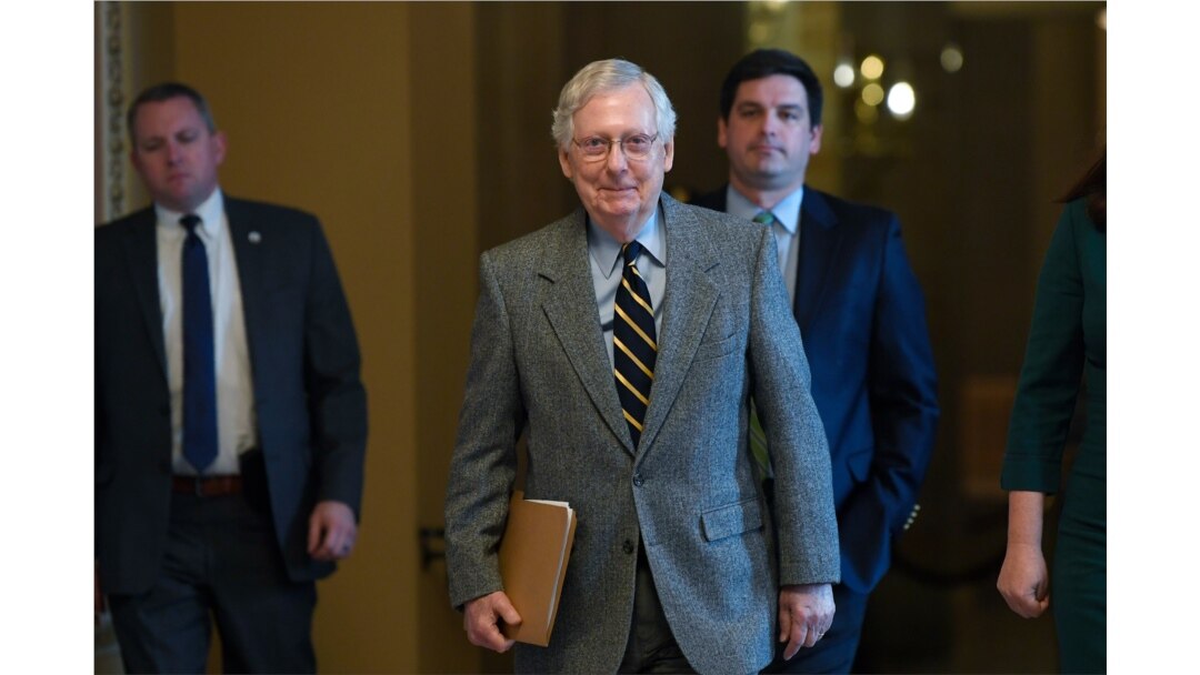 Senate Majority Leader Mitch McConnell of Kentucky walks on Capitol Hill in Washington, Jan. 3, 2020.