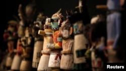 Kachina dolls made by the Native American Hopi and Zuni tribes are displayed at the Drouot auction house in Paris before auction, December 15, 2014.