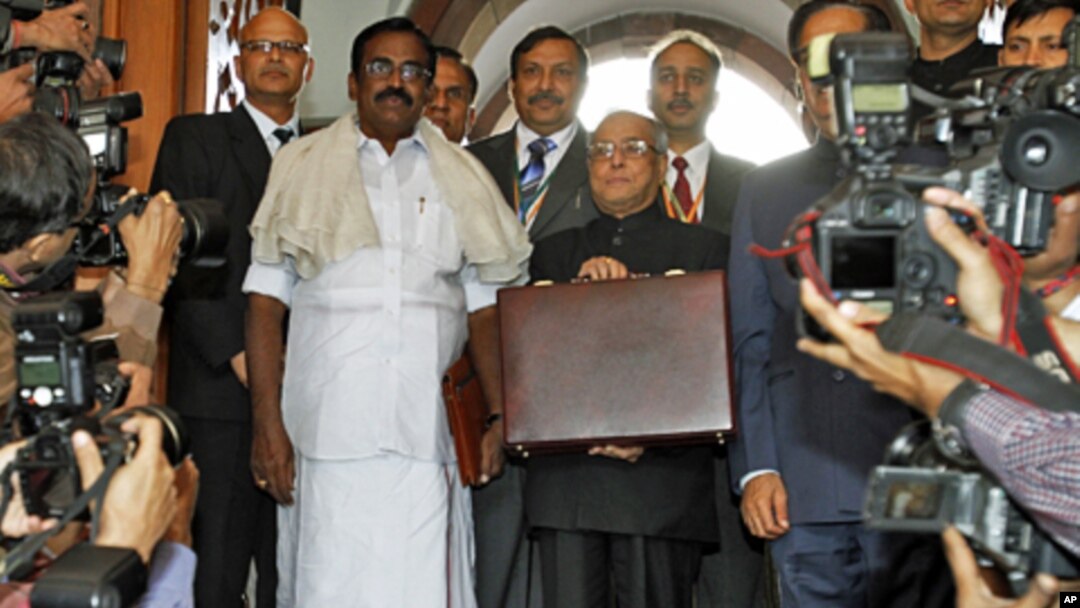 India's Finance Minister Pranab Mukherjee arrives at the parliament to present the federal budget in New Delhi, February 28, 2011