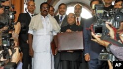 India's Finance Minister Pranab Mukherjee arrives at the parliament to present the federal budget in New Delhi, February 28, 2011