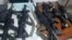 Some of the weapons seized by Haiti's national police force officers (PNH) Sunday after arresting 8 men who are charged with "conspiracy". 