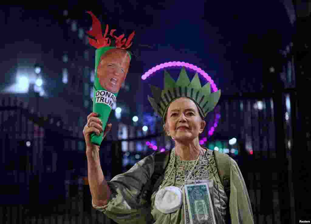 A woman dressed as the Statue of Liberty attends a protest against the inauguration of Donald Trump as U.S. president in London, Britain, Jan. 20, 2025.