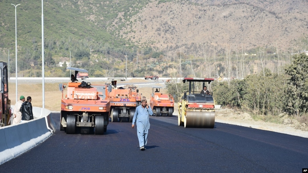 FILE - Work in progress at the site of Pakistan China Silk Road in Haripur, Pakistan, Dec. 22, 2017. 