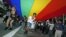 Participants hold a giant rainbow flag to symbolize lesbian, gay, bisexual, and transgender rights during a parade in Hong Kong, November 2011. (file photo)