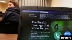 Liz Carlson, a self-employed student, attends a health care enrollment fair co-sponsored by Planned Parenthood of Northern New England and the State Employees Association at Great Bay Community College in Portsmouth, New Hampshire, Nov. 9, 2013.