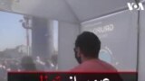 عبور از تونل ضدعفونی برای ورود به مرکز خرید در شیلی