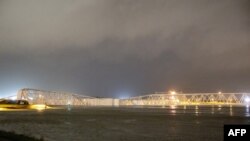 The Maeslantkering, a flood barrier on a canal leading to the port of Rotterdam, Netherlands, closes automatically on Dec 21, 2023 — for the first time in its history — due to high water levels caused by a storm. 