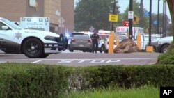 This still image provided by WATN-TV shows police and emergency personnel responding to a shooting at a Walmart in Southaven, Miss., July 30, 2019.