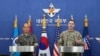 Col. Ryan Donald, right, of the U.S., and Col. Lee Sung-jun of South Korea attend a press briefing of the Ulchi Freedom Shield exercises at the Defense Ministry in Seoul, South Korea, Aug. 12, 2024