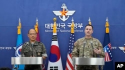 Col. Ryan Donald, right, of the U.S., and Col. Lee Sung-jun of South Korea attend a press briefing of the Ulchi Freedom Shield exercises at the Defense Ministry in Seoul, South Korea, Aug. 12, 2024