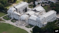 FILE - The remains of the presidential palace are seen after the earthquake in Port-au-Prince, Haiti, Jan. 17, 2010.