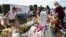 Volunteers, students and parents sort items left at the memorial site for the 17 students and faculty killed at Marjory Stoneman Douglas High School, Wednesday, March 28, 2018 in Parkland, Florida.