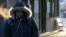 A commuter arrives at Metra Western Avenue station, in Chicago, Illinois, Jan. 29, 2019, as extreme cold and record-breaking temperatures are moving into the region.
