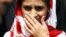 Geeta comes out from an airport after her arrival in New Delhi, India, Oct. 26, 2015. The deaf-mute Indian girl stranded in Pakistan for 13 years after wandering over one of the world's most militarized borders arrived home to be reunited with the family she has identified from photographs. 