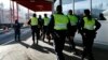 Swiss customs officers arrive at the Swiss-French customs post of Bardonnex near Geneva, Switzerland, Dec. 11, 2015. 