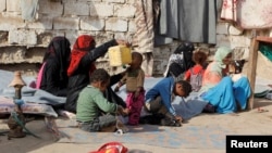 Internally displaced people sit at a makeshift camp for IDPs in al-Jarahi, south of the Red Sea port city of Houdieda, Yemen February 22, 2017. 