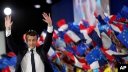 French independent centrist presidential candidate Emmanuel Macron waves to his supporters during a campaign rally in Paris, May 1st, 2017.