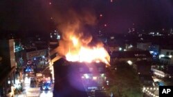 Flames and smoke rise from a fire affecting a small area of Camden Market in London, July 10, 2017.