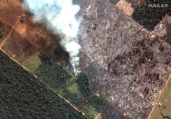 FILE - A satellite image shows smoke rising from Amazon rainforest fires in Rondonia state, southwest of Porto Velho, Brazil, in the upper Amazon River basin, Aug. 15, 2019. (Satellite image ©2019 Maxar Technologies)