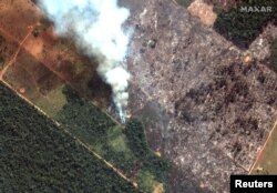 A satellite image shows smoke rising from Amazon rainforest fires in the State of Rondonia, just southwest of Porto Velho, Brazil in the upper Amazon River basin, Aug. 15, 2019. (Credit: Satellite image ©2019 Maxar Technologies)