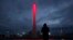 A lighting technician watches the rings form in a fountain at the base of the Olympic cauldron as preparations continue at the Olympic Park for the Sochi 2014 Winter Olympics in Russia.