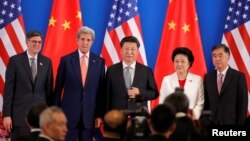 L-R, U.S. Treasury Secretary Jack Lew, U.S. Secretary of State John Kerry, China's President Xi Jinping, China's Vice Premiers Liu Yandong and Wang Yang, and State Councilor Yang Jiechi pose for photo during the joint opening ceremony of the 8th round of U.S.-China Strategic and Economic Dialogues and the 7th round of U.S.-China High-Level Consultation on People-to-People Exchange in Beijing June 6, 2016. 