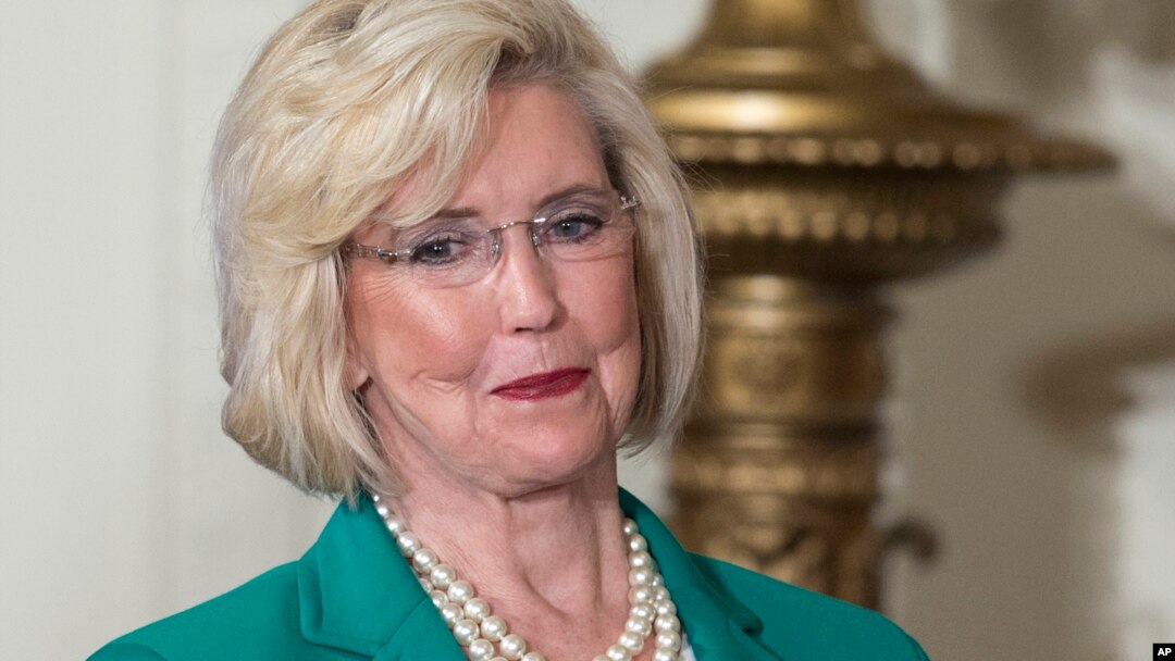 FILE - Lilly Ledbetter looks to the audience as President Barack Obama speaks in the East Room of the White House in Washington, April 8, 2014, during an event marking Equal Pay Day. 