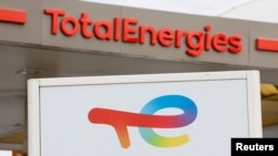 FILE - TotalEnergies signs are seen at a petrol station in Nice, France, October 10, 2022.