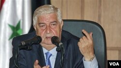 Menlu Suriah Walid Moallem mengecam sanksi-sanksi Uni Eropa dalam konferensi pers di Damaskus (22/6).