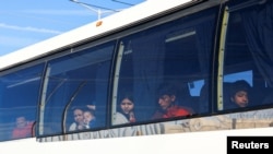 FILE - Migrants, mostly Venezuelans, are transported aboard a bus from Mexico's National Institute of Migration (INM) after being expelled from the United States through the Jeronimo-Santa Teresa border crossing in Ciudad Juarez, Mexico, Jan. 24, 2025. 