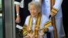 Kimlan Jinakul, 91, attends her graduation ceremony at Sukhothai Thammathirat Open University where she received a bachelor's degree from Thailand's King Maha Vajiralongkorn Bodindradebayavarangkun, near Bangkok, Aug. 9, 2017.