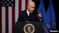 U.S. President Joe Biden gestures as he delivers remarks on the centennial anniversary of the Tulsa race massacre during a visit to the Greenwood Cultural Center in Tulsa, Oklahoma, June 1, 2021. 