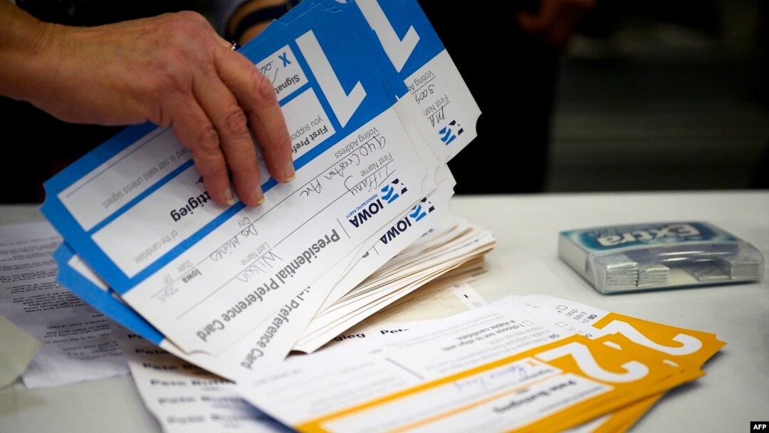 Votes are counted during caucusing in the 66th precinct at Abraham Lincoln High School in Des Moines, Iowa, on February 3, 2020. (Photo by JIM WATSON / AFP)