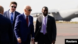 U.S. President Joe Biden boards Air Force One en route to Angola, in Sal