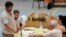Albanian election officials count votes in Tirana, June 24, 2013.