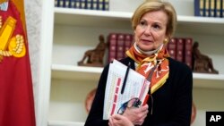 White House coronavirus response coordinator Dr. Deborah Birx listens during an event in honor of World Nurses Day in the Oval Office of the White House, May 6, 2020, in Washington.